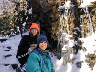 Zhanna and Gina pose on a slippery "stairway" near some sparkly icicles.