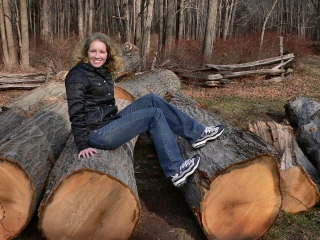 Zhanna stops to rest after chopping down a few trees.  All in a day's work!