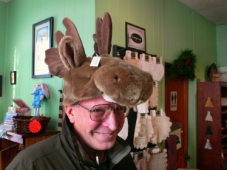 Reluctantly Rich tries on this moose hat.  I happen to think it's adorable!