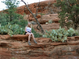 Zhanna finds a cool seat among the prickly pears.