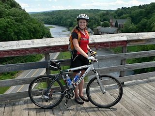 Zhanna and her bike on the trestle, overlooking Rosendale.