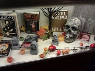 Right hand side of the case, featuring the skull, tombstones, and Elaine's Edward Gorey book that I want.
