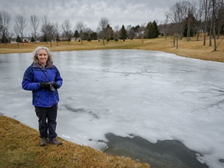 The pond is still partially frozen