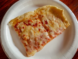 The pizza is light with a slightly peppery sauce.