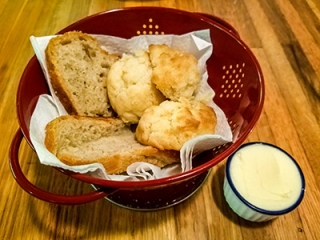 Whole wheat bread, biscuits and butter at Rogue Café
