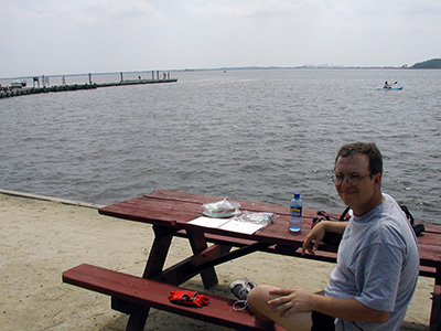 Aaron rests with the letterbox at a picnic table at Mulberry Landing.